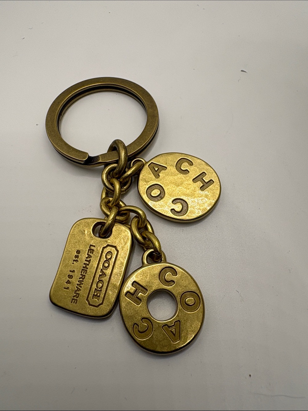 Coach Brass Logo Charm Keyring